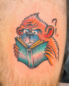Ezra Coates Brass Eagle Tattoo Peoria Traditional Monkey and Book