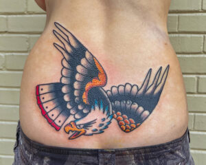 Ezra Coates Brass Eagle Tattoo Peoria Traditional Eagle on Lower Back