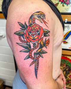 Ezra Coates Brass Eagle Tattoo Peoria Traditional Snake and Rose