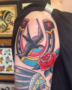 Sam Lott Brass Eagle Tattoo Peoria Traditional Horseshoe, Swallow, and Rose