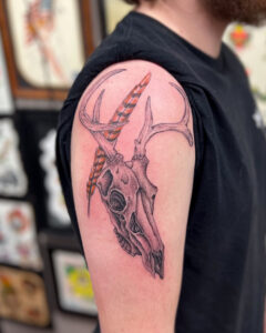 Zach Dole Brass Eagle Tattoo Peoria Realistic Skull and Feather