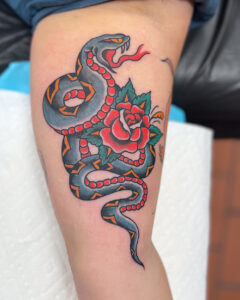 Zach Dole Brass Eagle Tattoo Peoria Traditional Snake and Rose